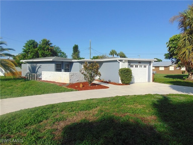 100 Waterview Ave, Lehigh Acres, FL 33936 - view of front of house with a garage, driveway, and a front yard