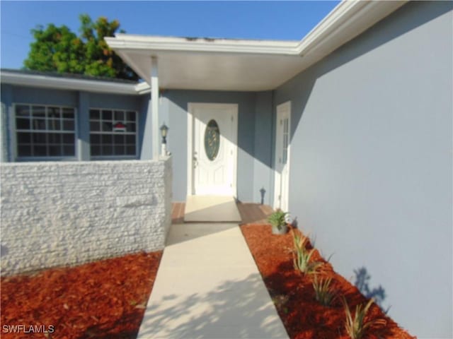 100 Waterview Ave, Lehigh Acres, FL 33936 - entrance to property featuring stucco siding