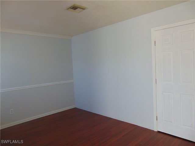 100 Waterview Ave, Lehigh Acres, FL 33936 - spare room with dark wood-type flooring and crown molding