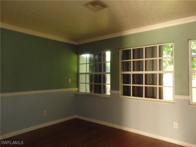 100 Waterview Ave, Lehigh Acres, FL 33936 - unfurnished room featuring dark wood-style floors, crown molding, and baseboards