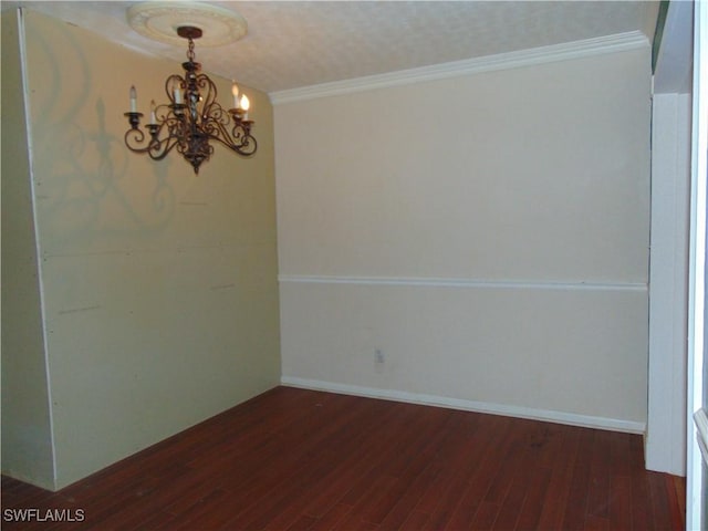 100 Waterview Ave, Lehigh Acres, FL 33936 - spare room with a chandelier, wood finished floors, and crown molding