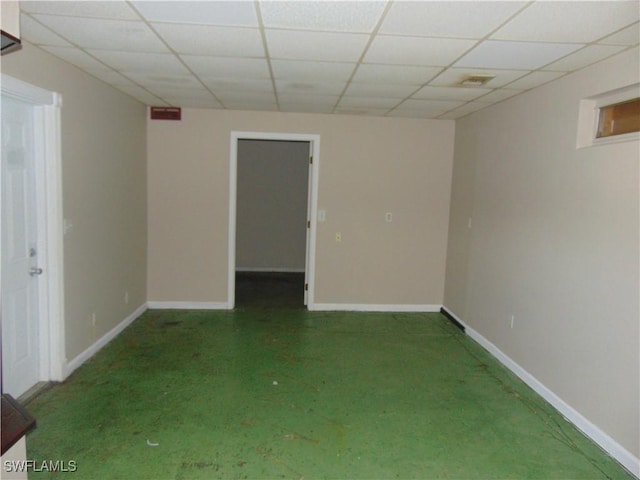 100 Waterview Ave, Lehigh Acres, FL 33936 - carpeted empty room featuring a paneled ceiling and baseboards
