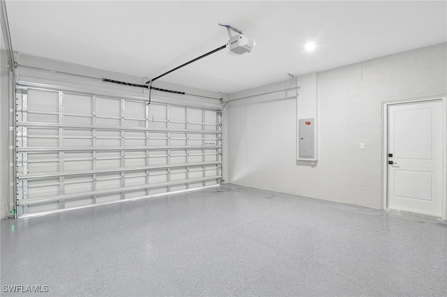 1072 Norton Ave S, Lehigh Acres, FL 33974 - garage with a garage door opener and electric panel