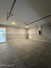 426 Mercedes Ct, Lehigh Acres, FL 33972 - garage featuring recessed lighting