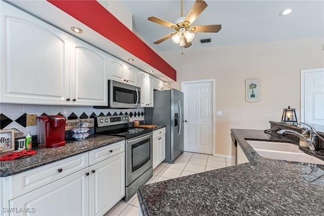 1927 SW 48th Ln, Cape Coral, FL 33914 - kitchen featuring appliances with stainless steel finishes, a sink, light tile patterned flooring, decorative backsplash, and recessed lighting