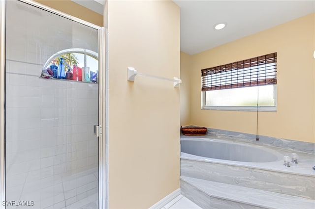 1927 SW 48th Ln, Cape Coral, FL 33914 - bathroom with a stall shower and a garden tub