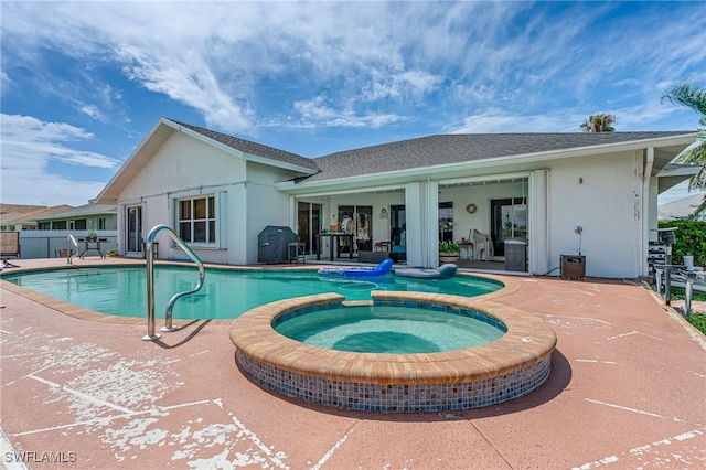 1927 SW 48th Ln, Cape Coral, FL 33914 - view of swimming pool featuring a patio area and a pool with connected hot tub