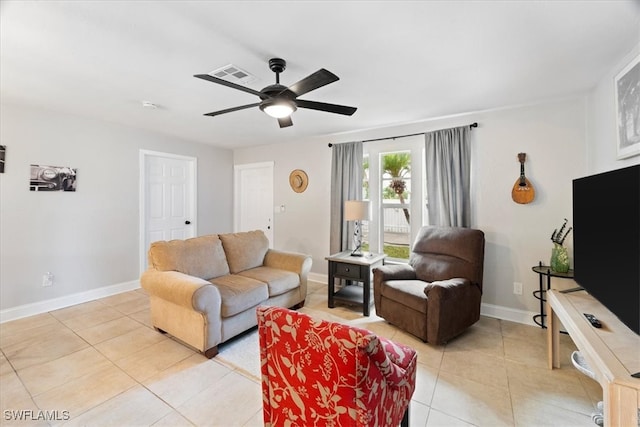 51-55 Lake St, North Fort Myers, FL 33903 - living area with light tile patterned floors, baseboards, and ceiling fan