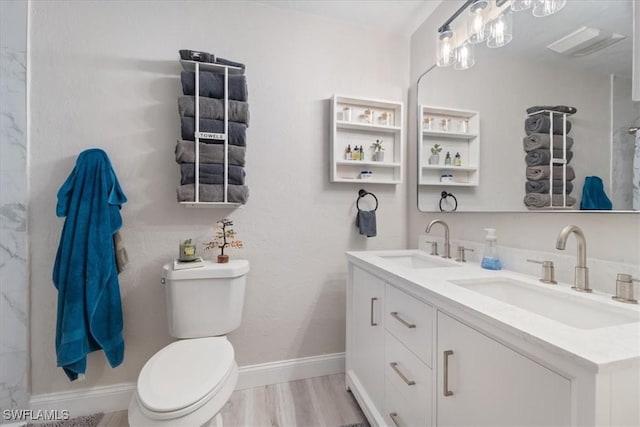 51-55 Lake St, North Fort Myers, FL 33903 - full bath featuring toilet, double vanity, baseboards, wood finished floors, and a shower
