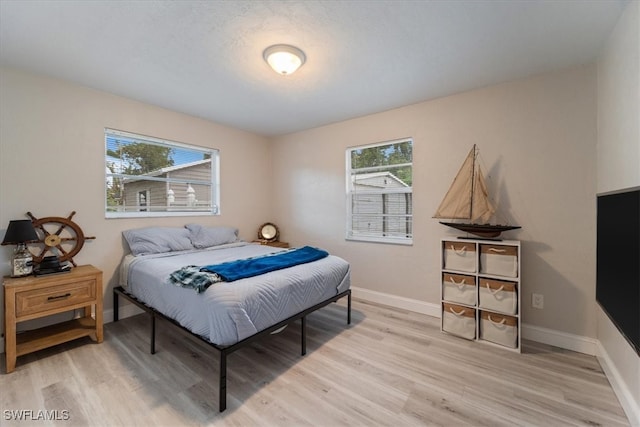 51-55 Lake St, North Fort Myers, FL 33903 - bedroom featuring light wood finished floors and baseboards