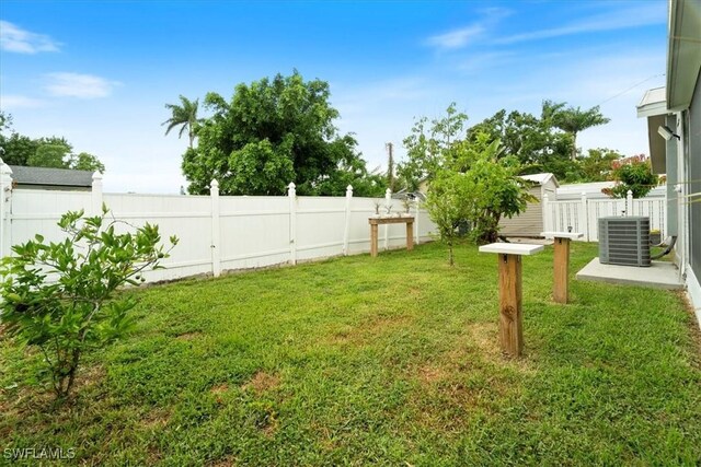 51-55 Lake St, North Fort Myers, FL 33903 - view of yard featuring central AC unit