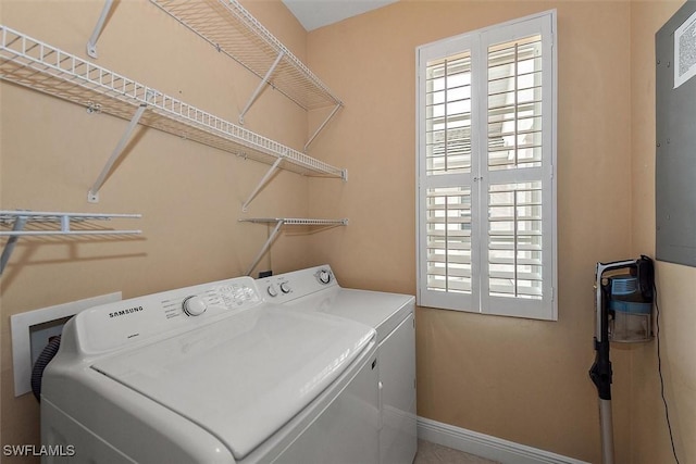 8375 Whisper Trace Ln Unit M203, Naples, FL 34114 - washroom featuring independent washer and dryer, plenty of natural light, and baseboards