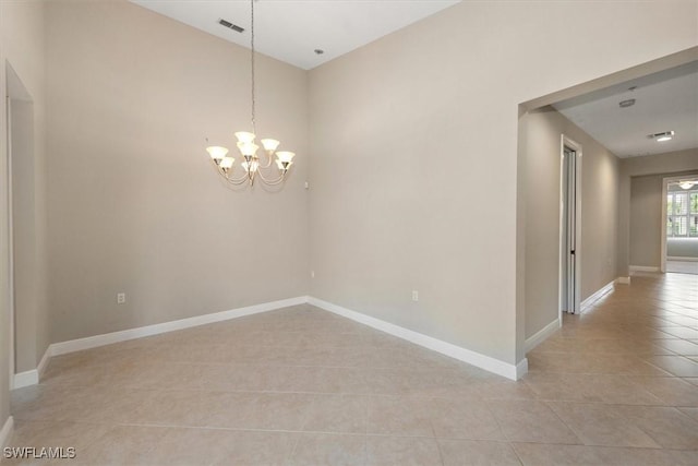 8375 Whisper Trace Ln Unit M203, Naples, FL 34114 - spare room with light tile patterned floors, baseboards, and a chandelier