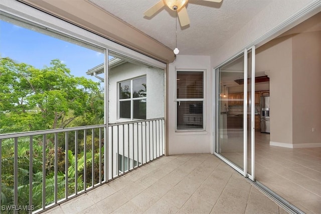 8375 Whisper Trace Ln Unit M203, Naples, FL 34114 - unfurnished sunroom with ceiling fan