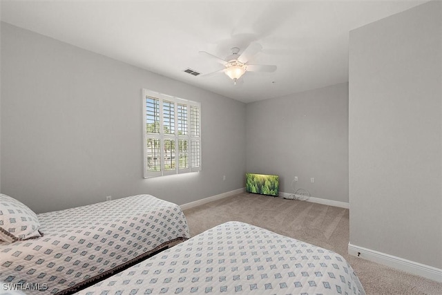 8375 Whisper Trace Ln Unit M203, Naples, FL 34114 - bedroom featuring light colored carpet, baseboards, and ceiling fan