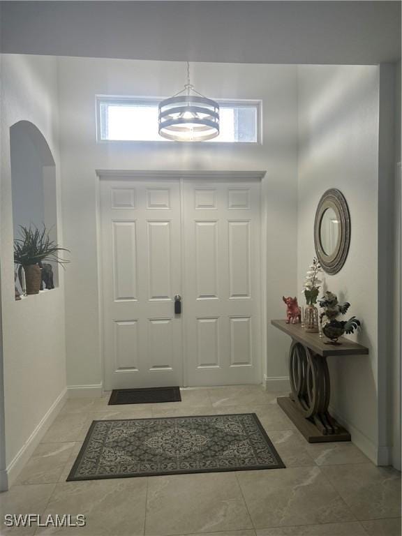 233 Baize Ave S, Lehigh Acres, FL 33974 - entryway with baseboards