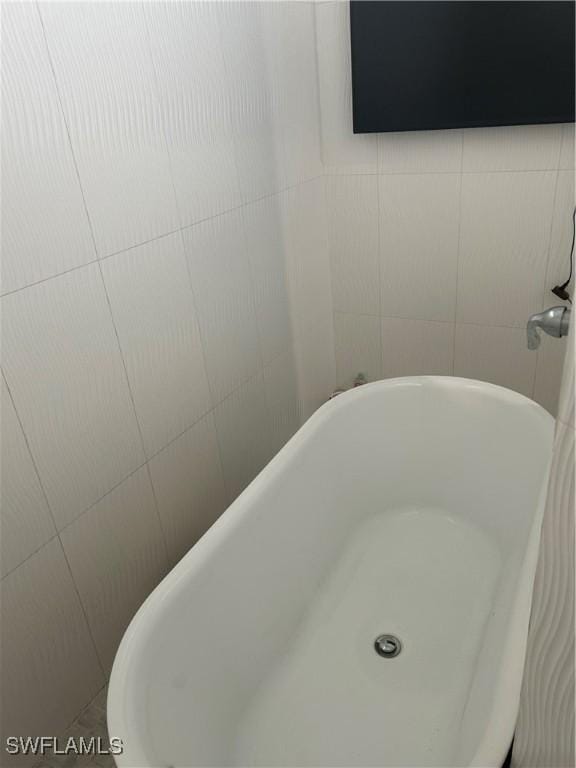 233 Baize Ave S, Lehigh Acres, FL 33974 - bathroom view of a freestanding bath