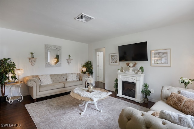 13219 2nd St, Fort Myers, FL 33905 - living area with dark wood-style flooring, baseboards, and a glass covered fireplace