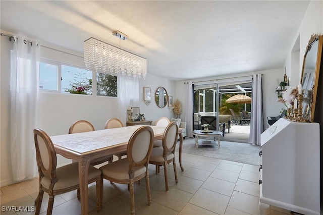 13219 2nd St, Fort Myers, FL 33905 - dining space with healthy amount of natural light, a chandelier, light tile patterned floors, and light carpet