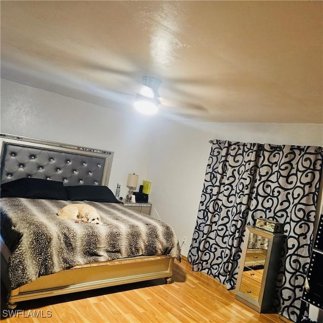 3411 22nd St SW, Lehigh Acres, FL 33976 - bedroom with wood finished floors and a ceiling fan