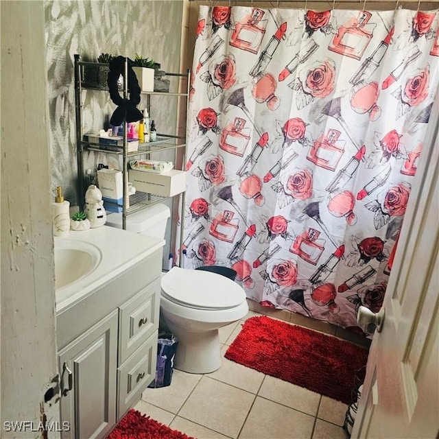 3411 22nd St SW, Lehigh Acres, FL 33976 - full bathroom featuring tile patterned flooring, vanity, toilet, and a shower with shower curtain