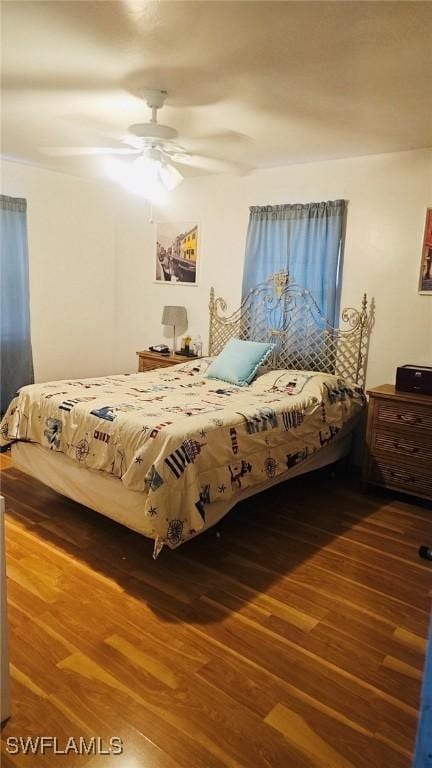 3411 22nd St SW, Lehigh Acres, FL 33976 - bedroom featuring wood finished floors and ceiling fan