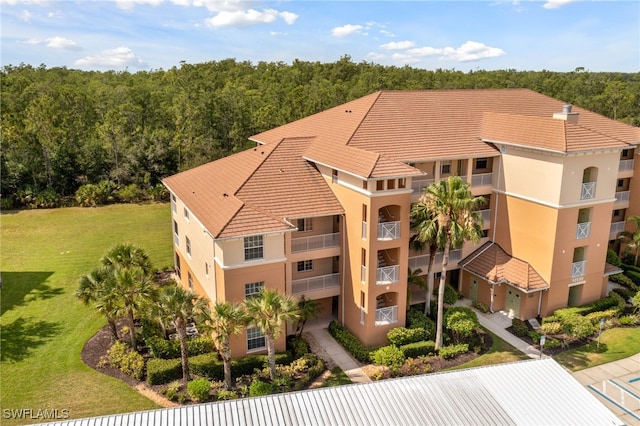 10530 Amiata Way Unit 201, Fort Myers, FL 33913 - view of building exterior featuring a view of trees
