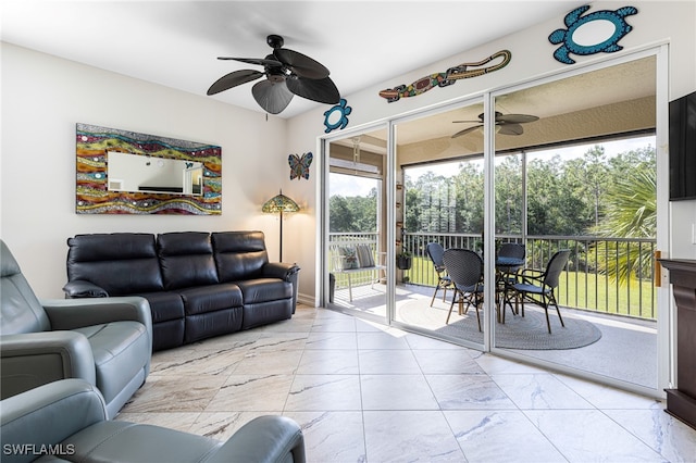 10530 Amiata Way Unit 201, Fort Myers, FL 33913 - living room with a ceiling fan and light marble finish flooring
