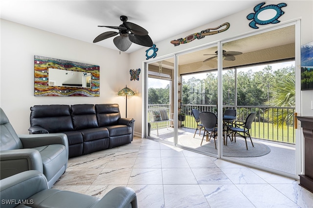 10530 Amiata Way Unit 201, Fort Myers, FL 33913 - living area featuring ceiling fan and marble look tiles