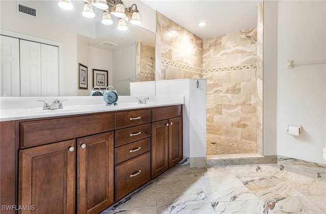 10530 Amiata Way Unit 201, Fort Myers, FL 33913 - full bathroom featuring walk in shower, double vanity, and marble tiled flooring