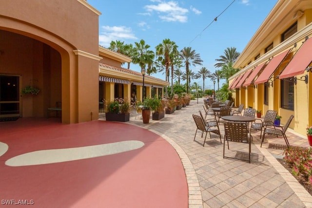 10530 Amiata Way Unit 201, Fort Myers, FL 33913 - view of patio / terrace featuring outdoor dining space