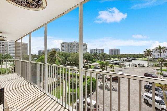 5 Bluebill Ave Unit 410, Naples, FL 34108 - balcony with a water view and a city view