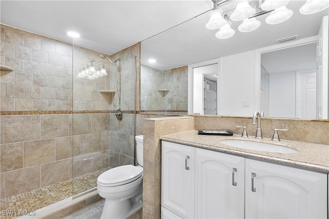 5 Bluebill Ave Unit 410, Naples, FL 34108 - full bath with vanity, a tile shower, and a chandelier