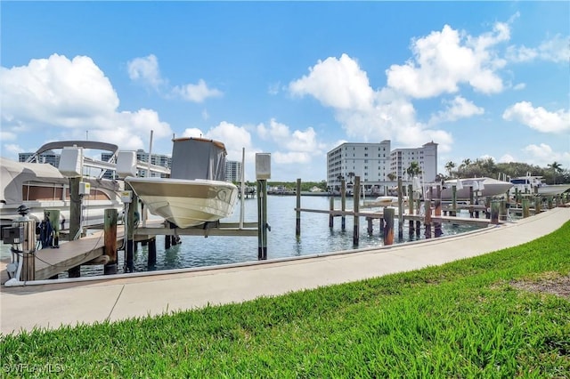 5 Bluebill Ave Unit 410, Naples, FL 34108 - dock featuring boat lift and a water view