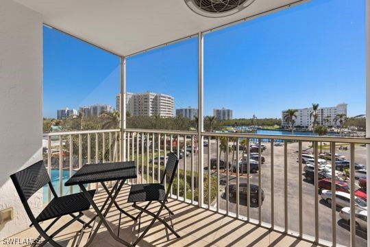 5 Bluebill Ave Unit 410, Naples, FL 34108 - balcony with a water view and a city view