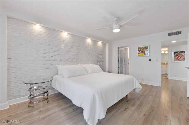 5 Bluebill Ave Unit 410, Naples, FL 34108 - bedroom with light wood-type flooring and ceiling fan