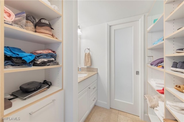5 Bluebill Ave Unit 410, Naples, FL 34108 - bathroom featuring tile patterned floors and vanity