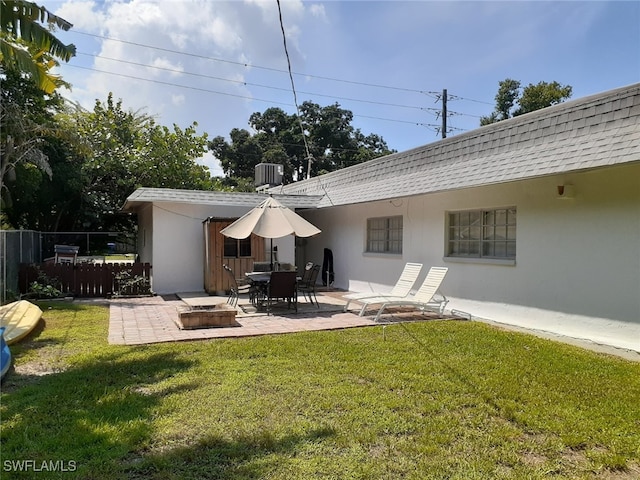 2979 Cortez Blvd, Fort Myers, FL 33901 - rear view of property featuring stucco siding, a patio area, a shingled roof, and central AC unit