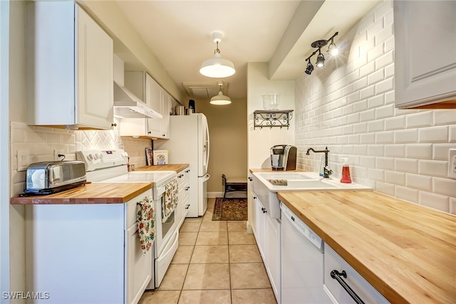 2979 Cortez Blvd, Fort Myers, FL 33901 - kitchen featuring butcher block counters, white appliances, backsplash, white cabinetry, and light tile patterned flooring