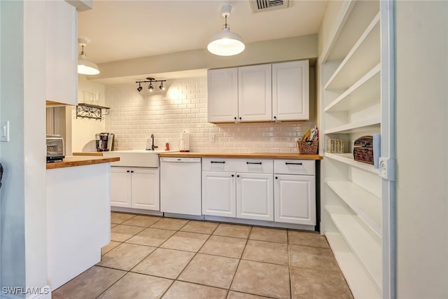 2979 Cortez Blvd, Fort Myers, FL 33901 - kitchen featuring dishwasher, butcher block counters, open shelves, and white cabinets