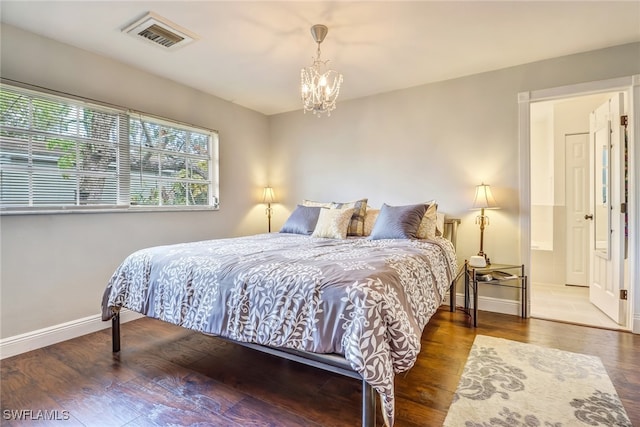2979 Cortez Blvd, Fort Myers, FL 33901 - bedroom with wood finished floors, baseboards, and a chandelier