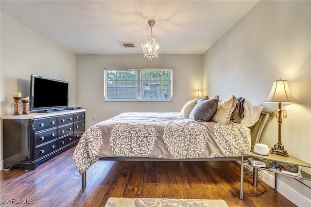 2979 Cortez Blvd, Fort Myers, FL 33901 - bedroom with a chandelier, wood finished floors, and baseboards