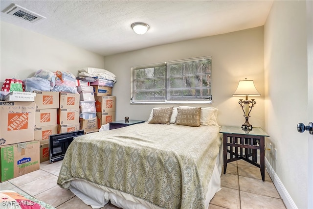 2979 Cortez Blvd, Fort Myers, FL 33901 - bedroom with light tile patterned flooring and a textured ceiling