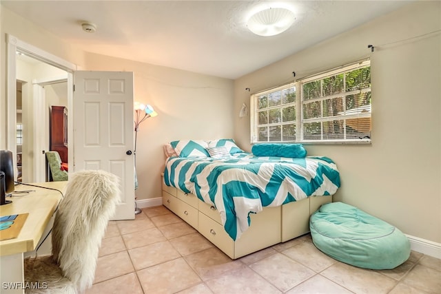 2979 Cortez Blvd, Fort Myers, FL 33901 - bedroom with light tile patterned flooring and baseboards
