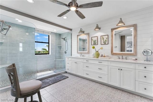 11640 Court Of Palms Unit 304, Fort Myers, FL 33908 - bathroom with double vanity, a stall shower, a ceiling fan, recessed lighting, and tile patterned floors