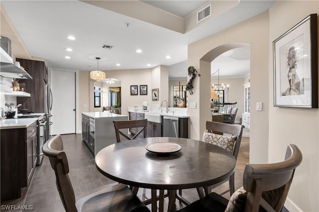 11640 Court Of Palms Unit 304, Fort Myers, FL 33908 - dining area with recessed lighting, arched walkways, and a chandelier