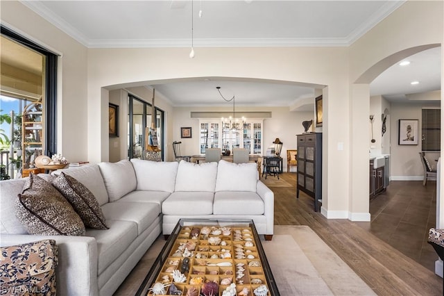 11640 Court Of Palms Unit 304, Fort Myers, FL 33908 - living room featuring arched walkways, crown molding, dark wood-type flooring, a chandelier, and recessed lighting