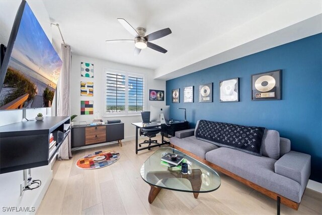 2104 W First St Unit 1402, Fort Myers, FL 33901 - living room with an office area, ceiling fan, and wood finished floors