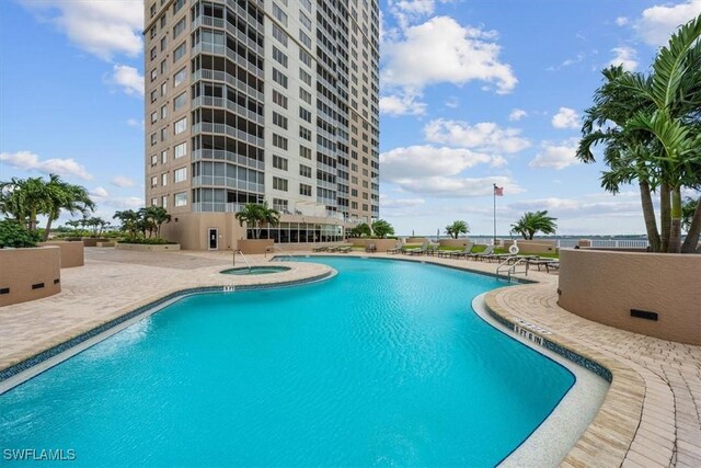 2104 W First St Unit 1402, Fort Myers, FL 33901 - community pool with a patio area and a community hot tub