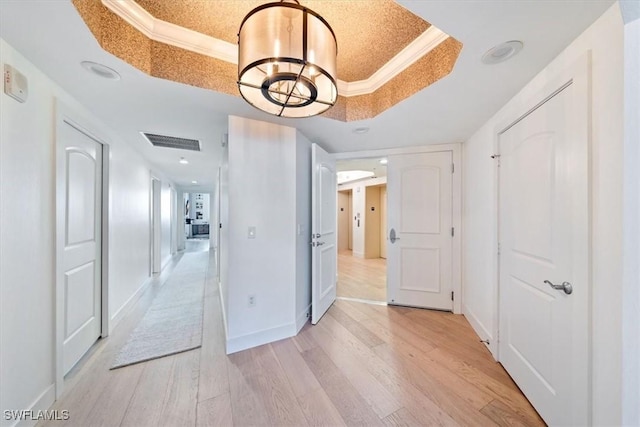 2104 W First St Unit 1402, Fort Myers, FL 33901 - hall with a raised ceiling, light wood finished floors, a chandelier, baseboards, and recessed lighting